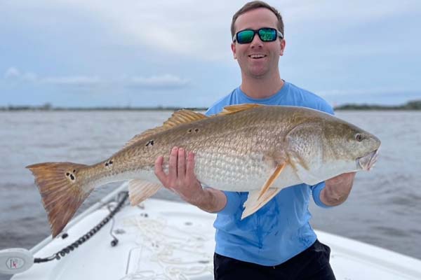 man holding a fish